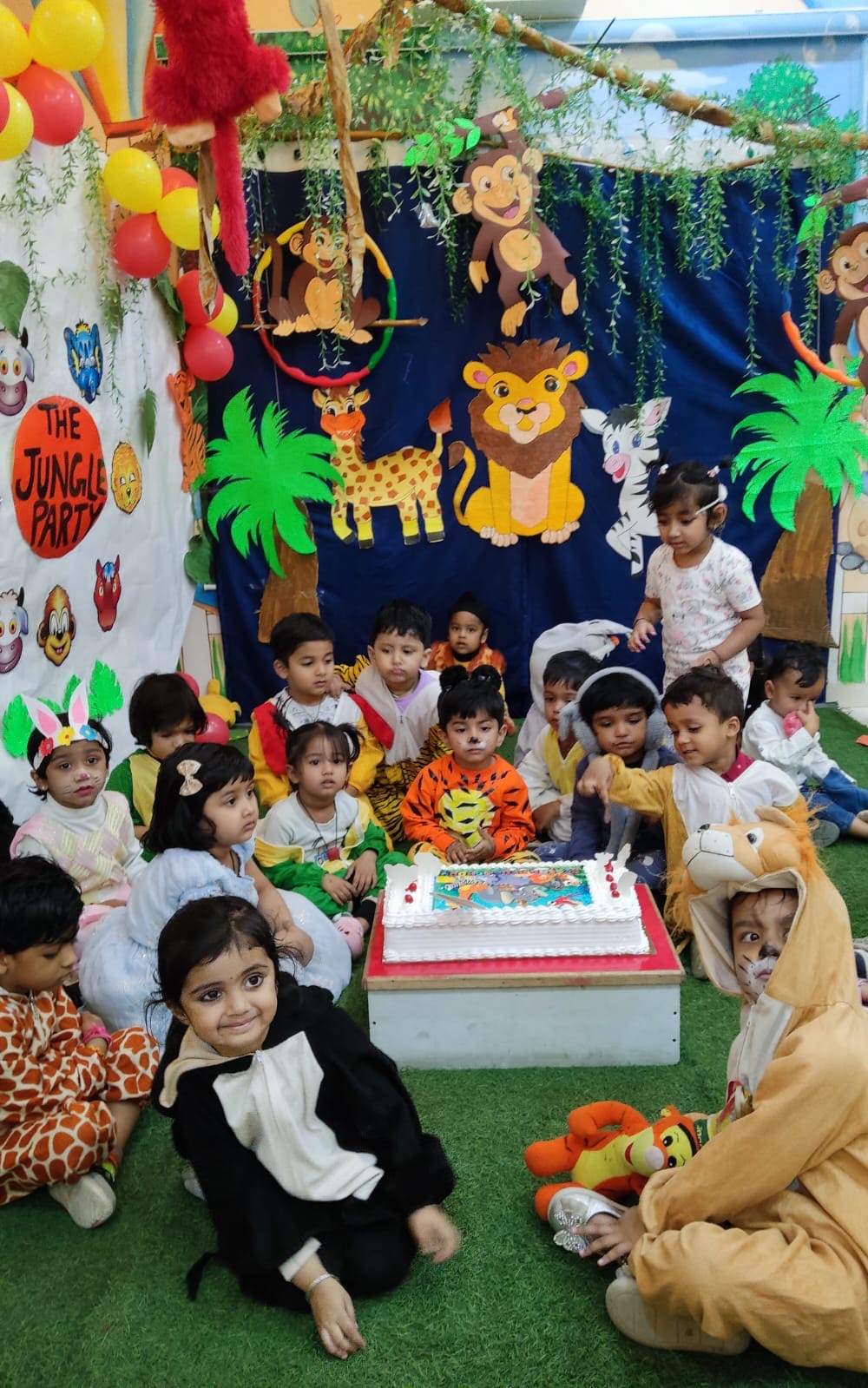 Children in animal costumes at jungle-themed party